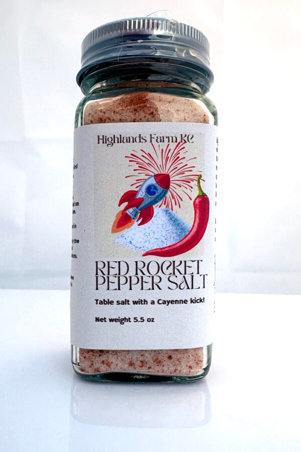 Product image of red rocket cayenne table salt in a square glass jar with a label and a silver bottle top with safety wrap