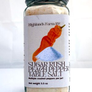 Sugar Rush Peach Pepper table salt in a square glass jar with a silver lid and safety wrap