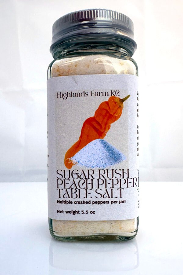 Sugar Rush Peach Pepper table salt in a square glass jar with a silver lid and safety wrap