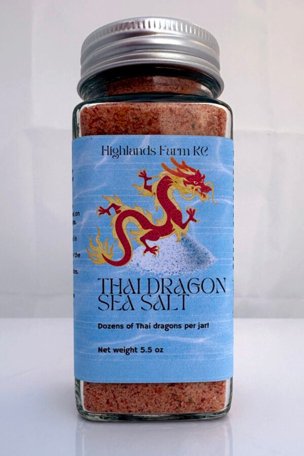 Thai Dragon sea salt product image with a square glass jar a silver bottle top and a blue label on the jar